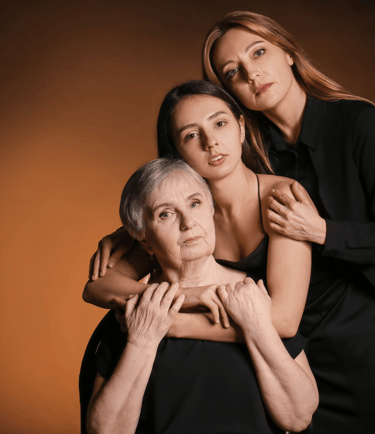 a woman in a black dress and two other women