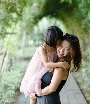 Mother and daughter sharing affectionate moment at Padma Resort Legian Bali during relaxed family photography session.
