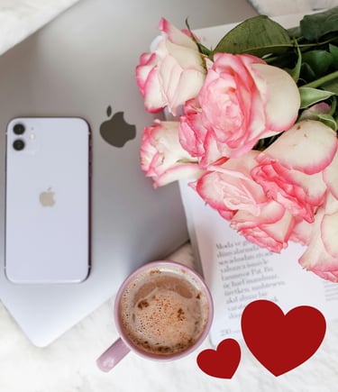 a cup of coffee and a bouquet of roses, a laptop, a phone, a paper and 2 hearts