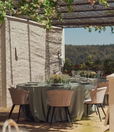 Outdoor dining table under vines at Finca Santa Katerina
