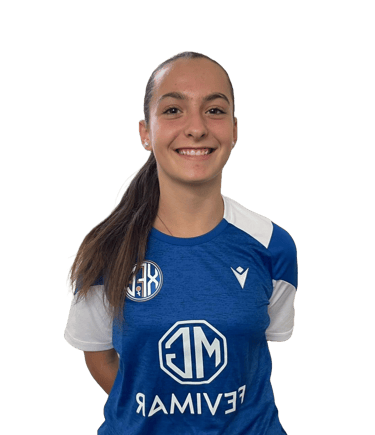 a woman in a blue shirt and black pants