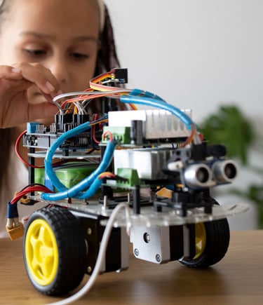a girl is playing with a robot