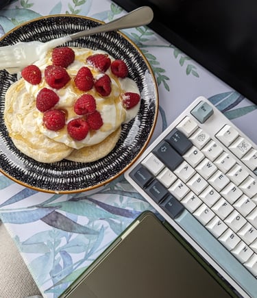 a plate with a plate of food and a laptop