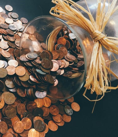 a glass jar with coins