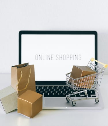 a laptop and shopping cartonce with a shopping carton