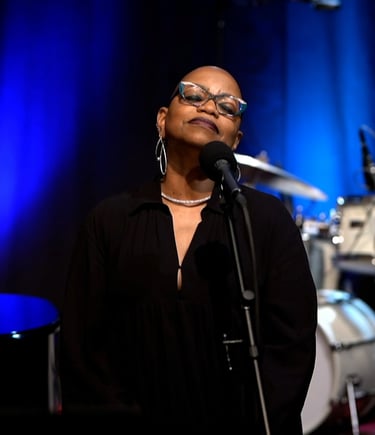 Tiya Adé in a reflective moment during her performance.