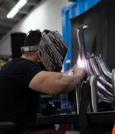 Don Abenante welding custom fabricated car headers