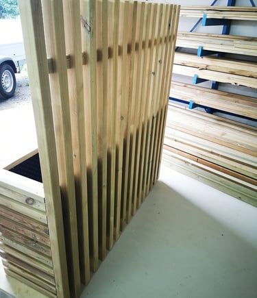 a wooden fenced in area with a wooden fence