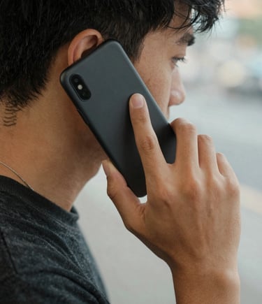 A friendly Junk Kings team member helping a customer load junk into a truck on a sunny day.