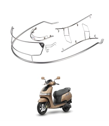 A beige TVS iQube electric scooter shown below a disassembled chrome safety guard set.