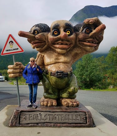 Lady Michelle and a 3-headed troll near Trollstigen, Norway
