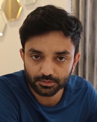 Customer :a man with a beard and a blue shirt named Aakash Sood