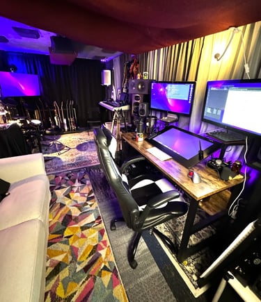 studio desk with controls and screens