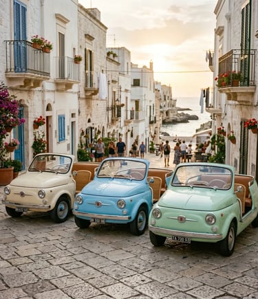 Three pastel vintage Fiat 500 Spiaggina cars parked on a cobblestone street in Polignano old town