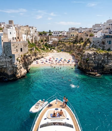Luxury yacht anchored at Lama Monachile cove in Polignano a Mare with turquoise Adriatic water