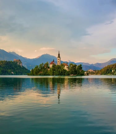 Peaceful Lake Bled with island church reflection and Julian Alps in background, Slovenia