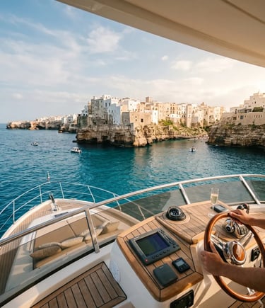 Flybridge perspective with steering wheel overlooking Polignano a Mare cliffs and Adriatic Sea