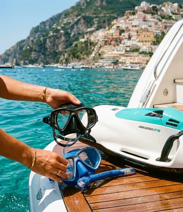 Hands holding snorkel masks beside Sea Scooter on yacht swim platform near Positano