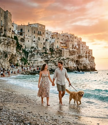 Couple and golden retriever walk Lama Monachile beach below Polignano cliffs at sunset.