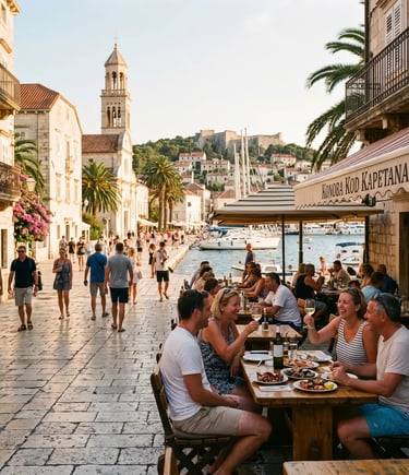 Travelers dining at Hvar harbor restaurant with bell tower and Venetian architecture in sunlight