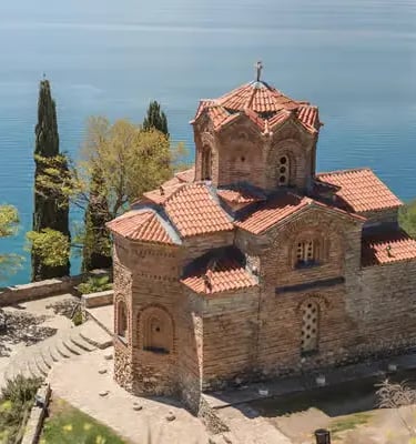 Byzantine Church of Saint John at Kaneo overlooking turquoise Lake Ohrid in North Macedonia