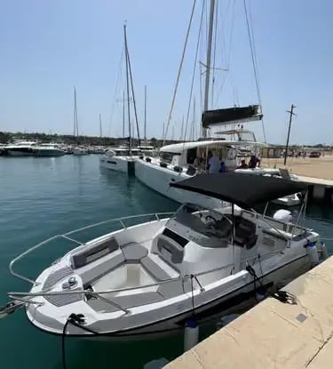 Modern private speedboat docked at sunny marina in Polignano a Mare, Italy