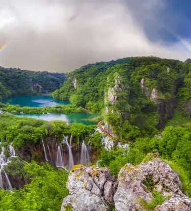 Aerial view of Plitvice Lakes waterfalls with double rainbow, Croatia