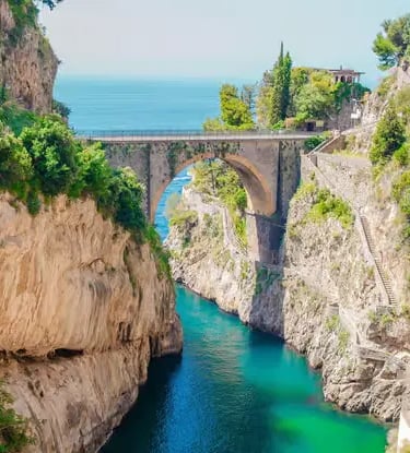Fiordo di Furore narrow fjord with turquoise water between dramatic cliffs on the Amalfi Coast