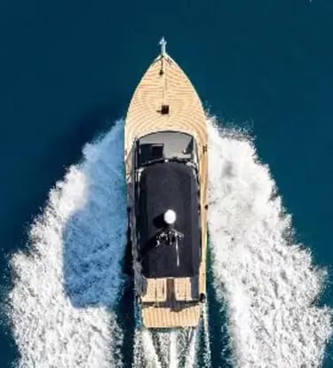 Aerial top-down view of a luxury speedboat cruising on deep blue Adriatic Sea near Split, Croatia
