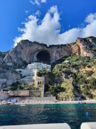 Conca dei Marini coastline with dramatic sea cave and cliffs seen from Amalfi Coast boat tour