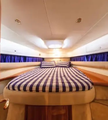 Cranchi 39 luxury yacht cabin interior with double bed and Italian wood finish design