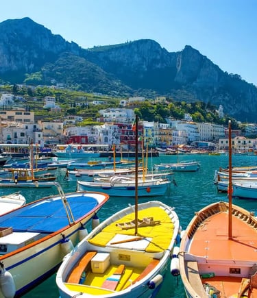 Traditional gozzo boats docked in Marina Grande harbor below Monte Solaro in Capri