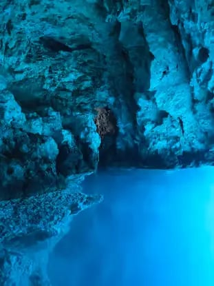 Glowing blue water inside the Blue Cave on Biševo Island during morning Croatia boat tour