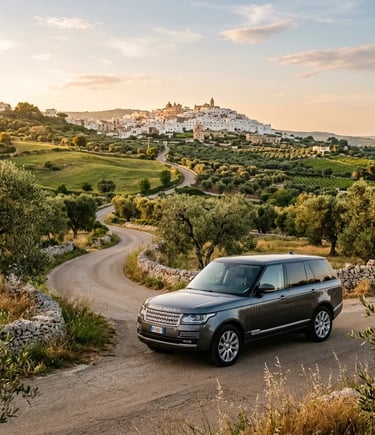 Luxury private transfer vehicle on scenic Puglia countryside road near hilltop village