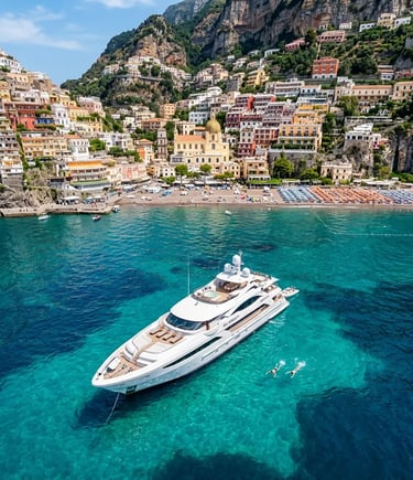 Luxury yacht anchored at Positano Spiaggia swim stop on Capri boat tour with swimmers