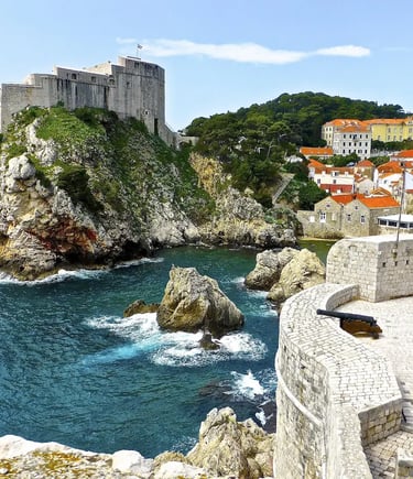 Dubrovnik city walls with Fort Lovrijenac on cliff above turquoise Adriatic Sea