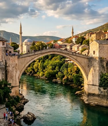 Stone arch of Stari Most bridge over emerald Neretva River with minarets and old houses in Mostar