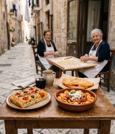 Focaccia barese, orecchiette pasta and panzerotti on table with nonnas making pasta in Bari Vecchia