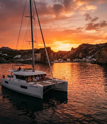 Premium Milos catamaran cruise at golden sunset, returning from Kleftiko boat tour Greece