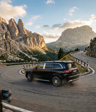 Black luxury SUV driving winding mountain road surrounded by Dolomite peaks