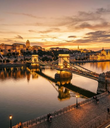 Budapest Chain Bridge and Buda Castle illuminated at golden hour over the Danube River