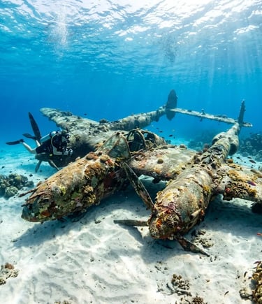 Diver exploring sunken military plane on sandy seabed in shallow water near Trogir Croatia