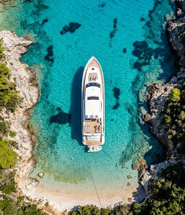 Aerial top-down view of luxury yacht anchored in secluded turquoise cove Zakynthos Greece
