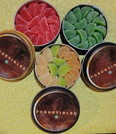 4 round tins with colorful cannabis gummies inside