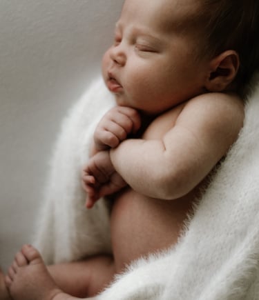 Newborn photography session in Adelaide Hills capturing mother holding baby naturally