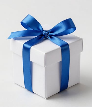 Close-up of delicate wedding favor boxes tied with sky blue twine on ivory linen.