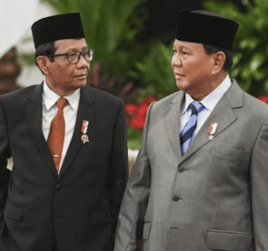 two men in suits and hats standing next to each other