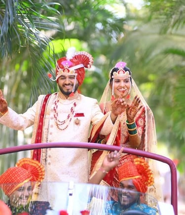 a man and woman in traditional indian wedding attire