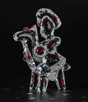 SIURELL of a glass sculpture of a woman sitting on a chair
