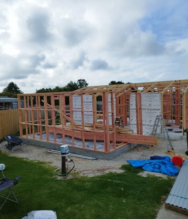 a architect house being built into a house from plans from a draftsman